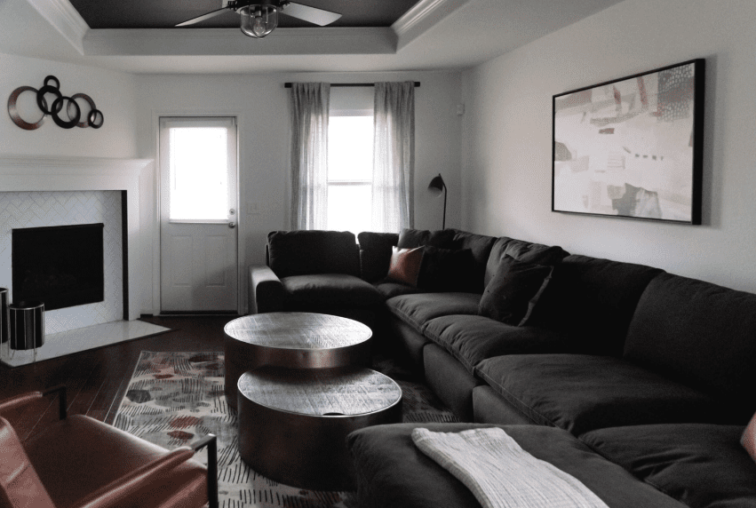 41 Living Room Ideas With Black Couches, From Neutral to Bold