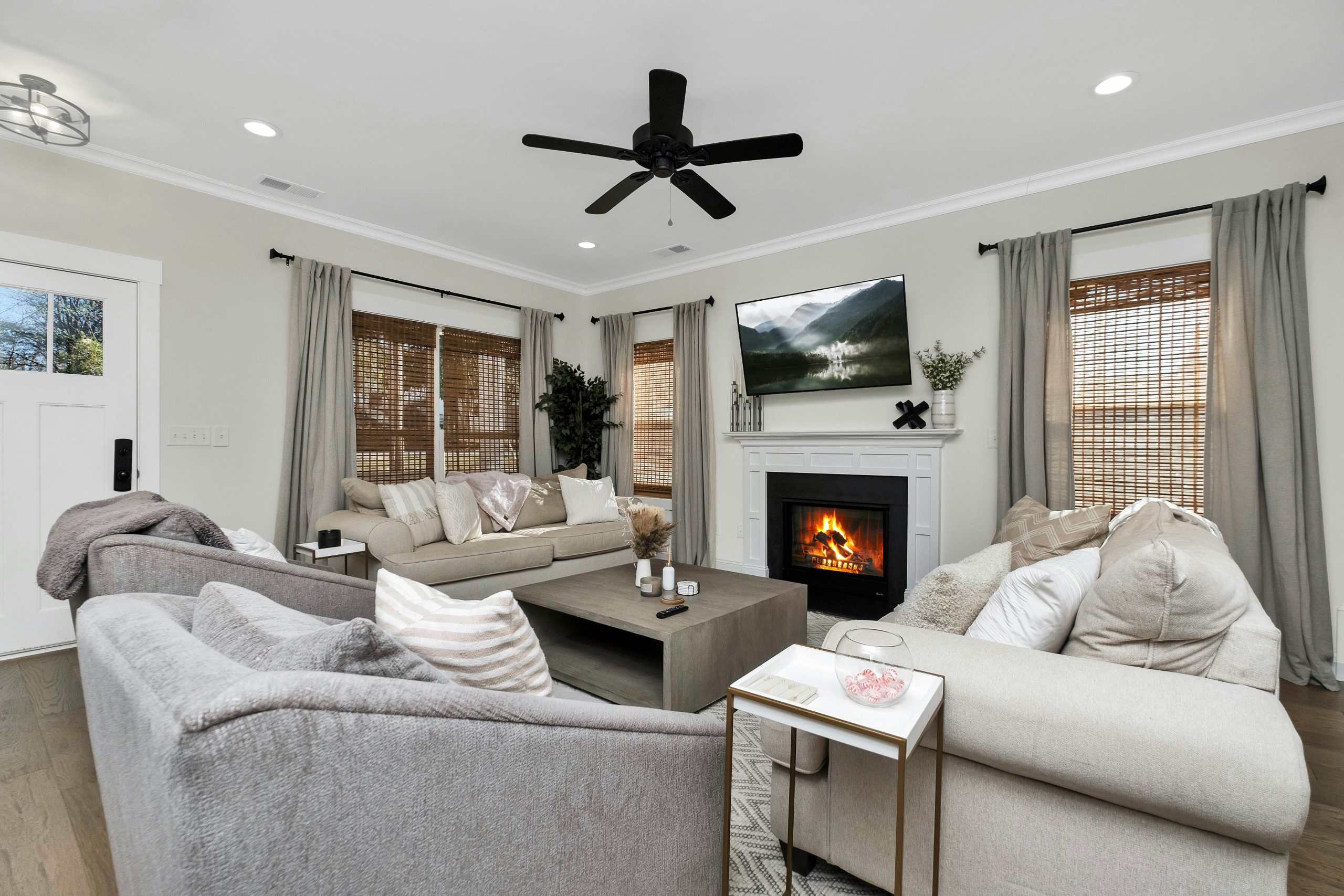 a living room filled with furniture and a fire place