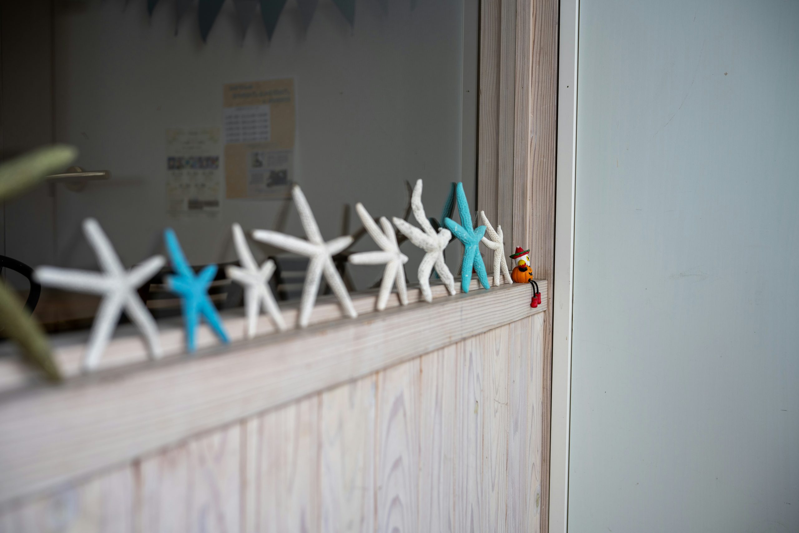 a row of small white and blue snowflakes on a wall