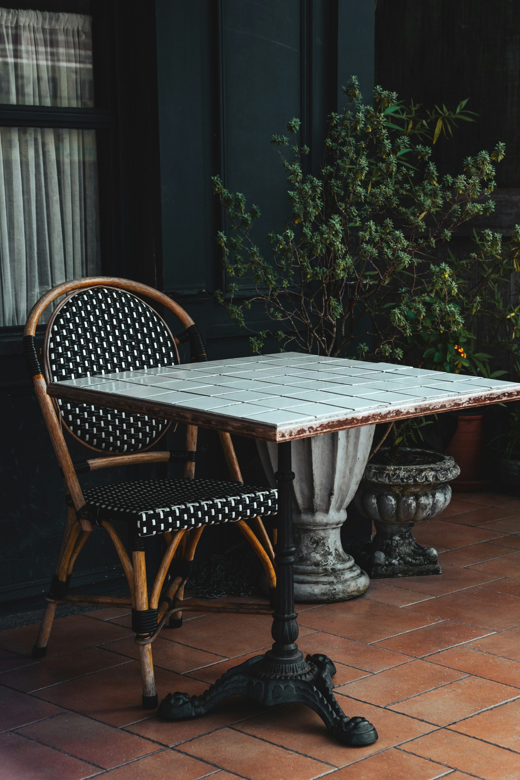 a table and two chairs sitting on a patio