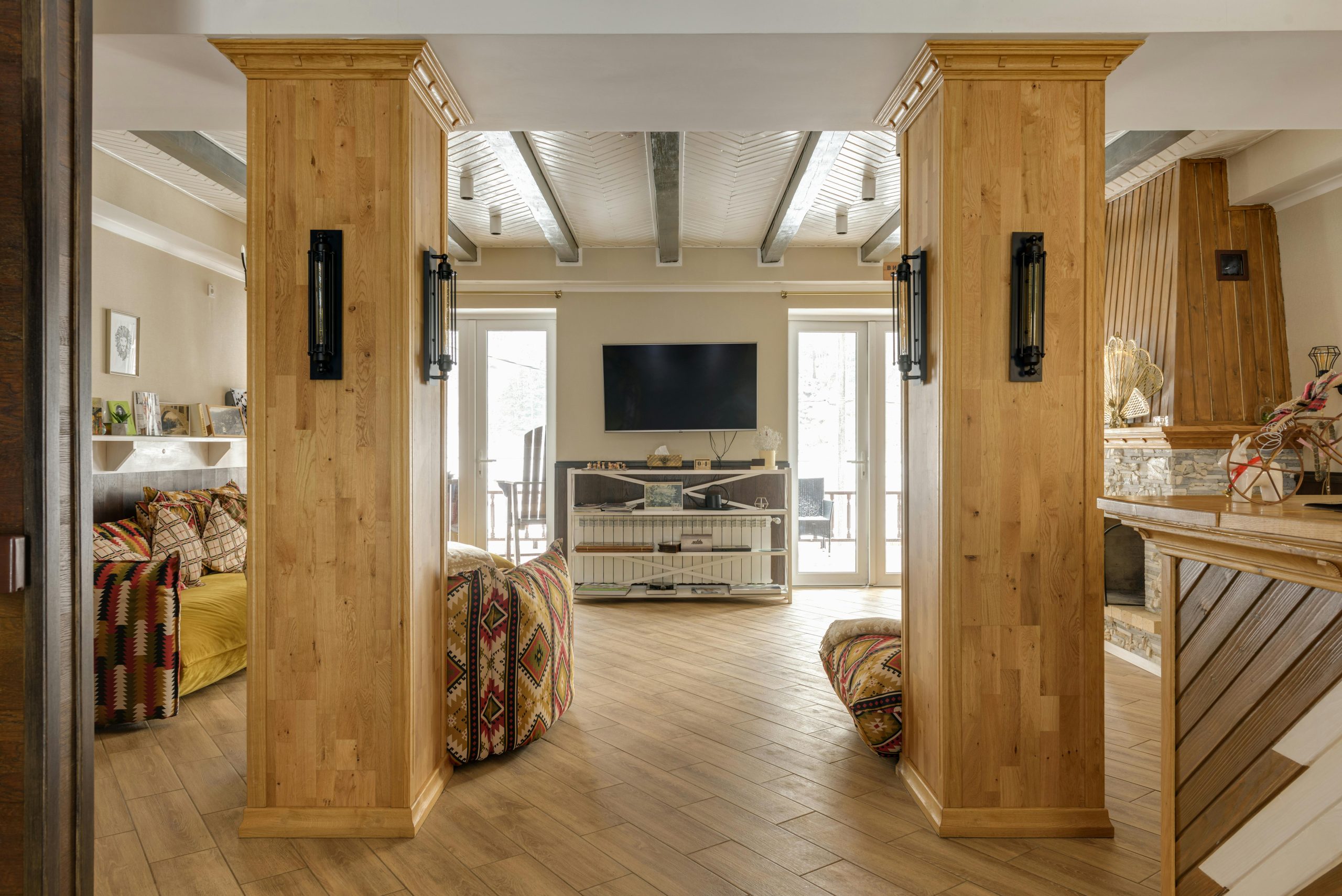 A warm modern living room featuring wooden accents, natural light, and inviting decor.