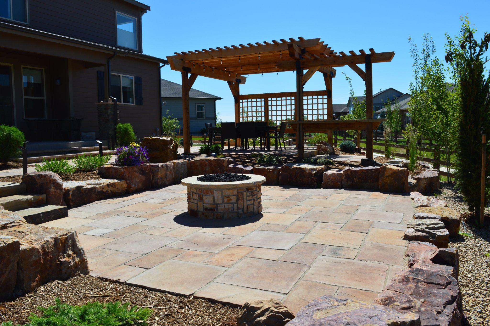 Building a Fire Pit or Outdoor Fireplace for Fall Gatherings | Grounded Landscape Designs