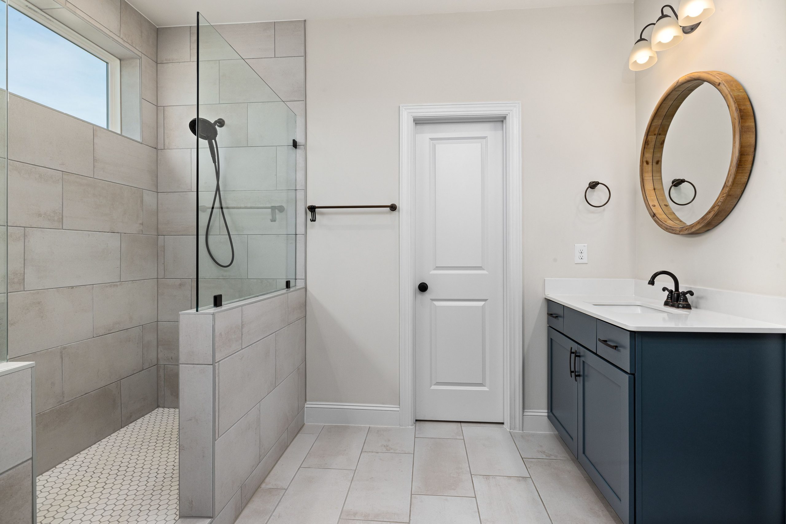 Contemporary bathroom featuring a glass shower and minimalist design.