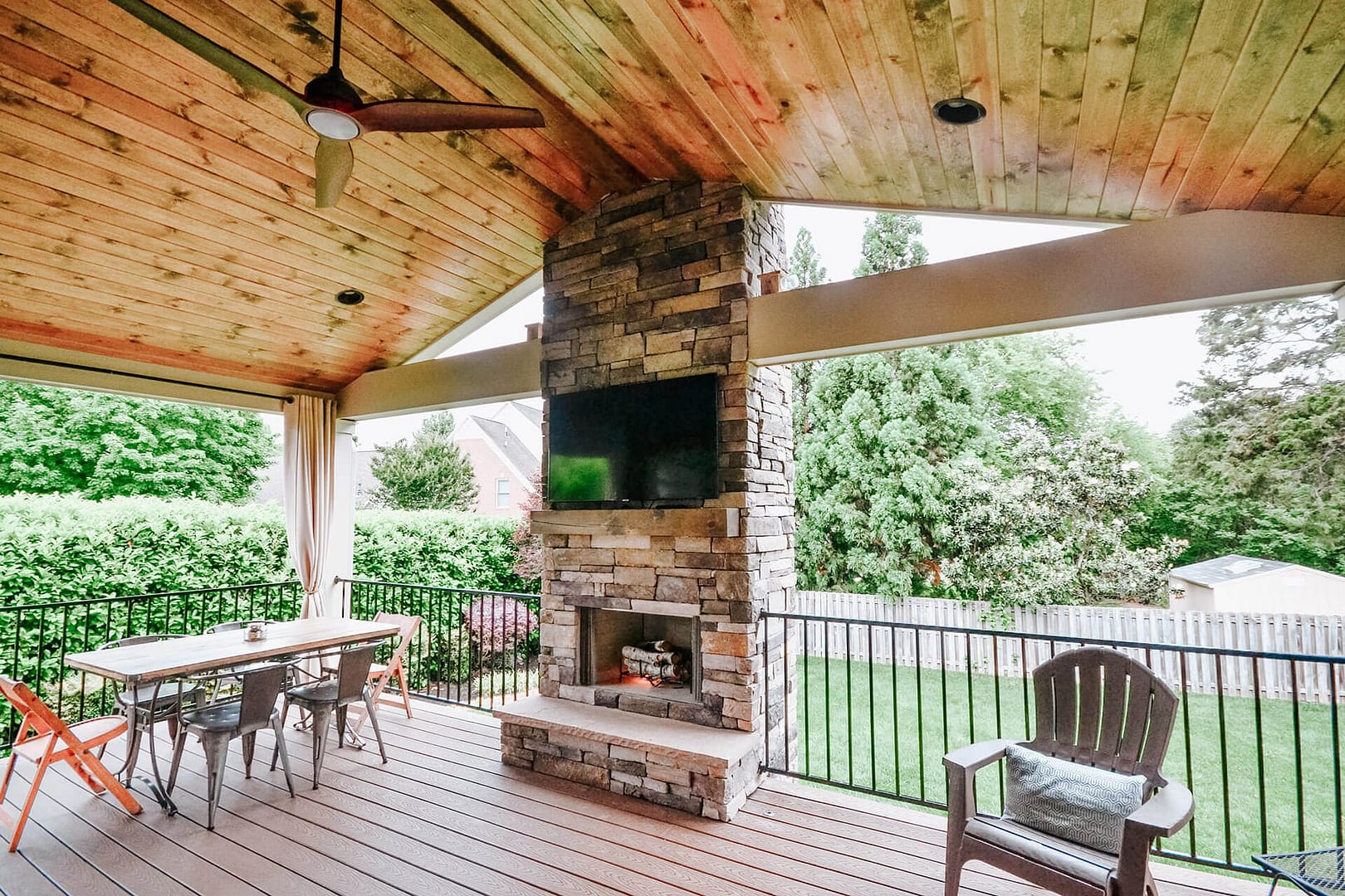 Cozy Outdoor Living: Covered Deck With Fireplace Extends Living Space For Westmoreland Family - McCamy Construction | McCamy Construction