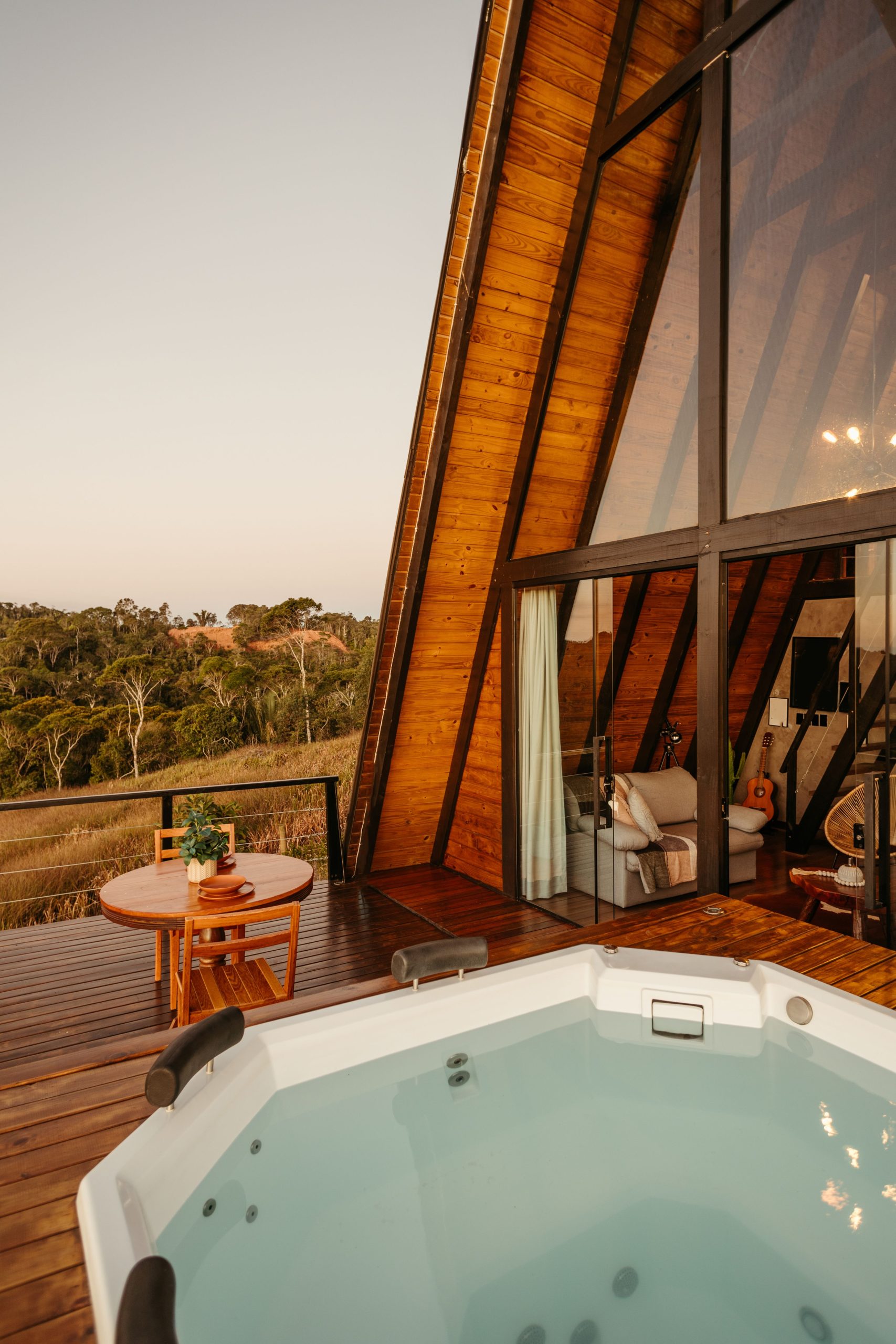 Experience tranquility in this stunning A-frame cabin with a jacuzzi and forest view.