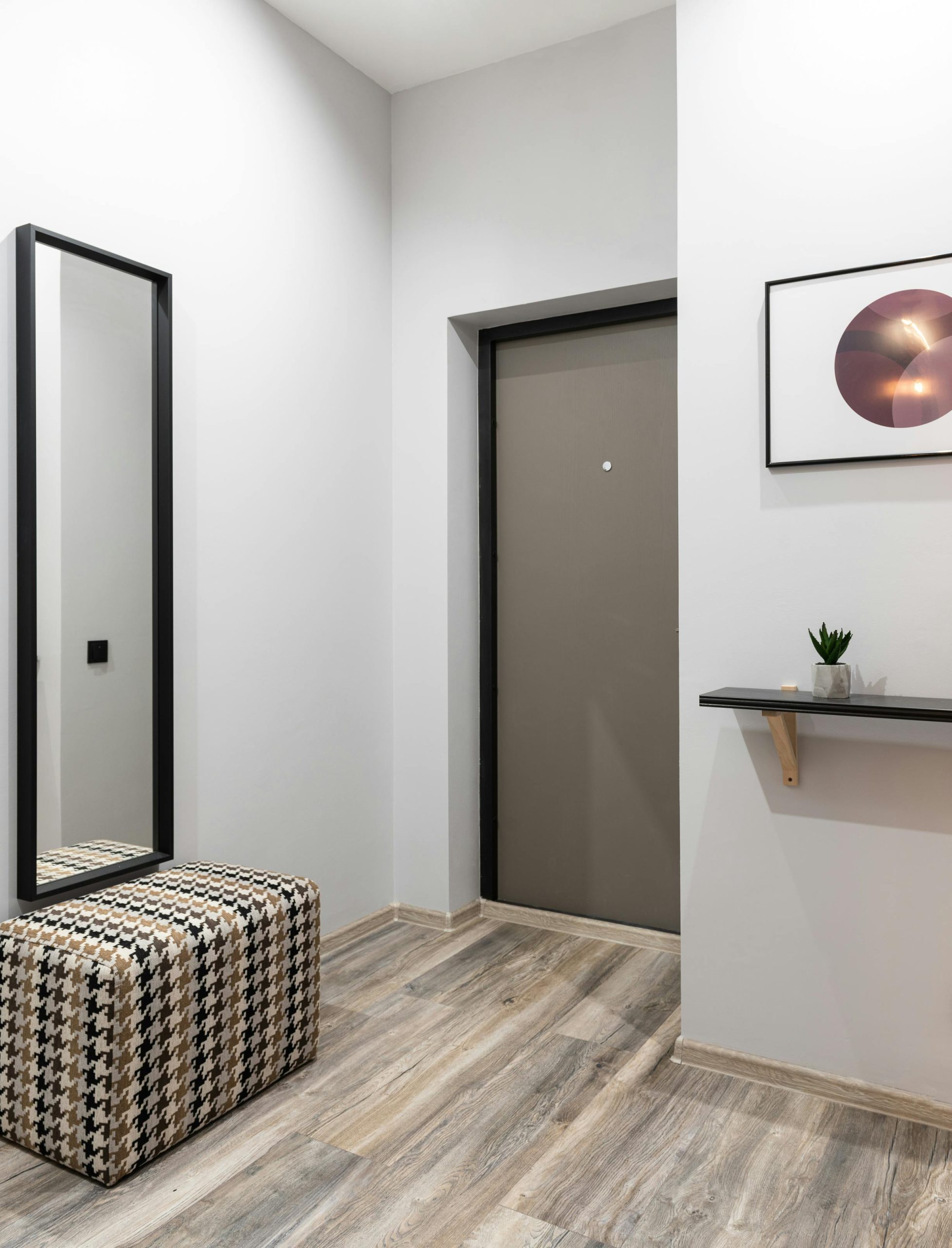 Interior of light hallway in minimalistic style placed in modern apartment in daytime