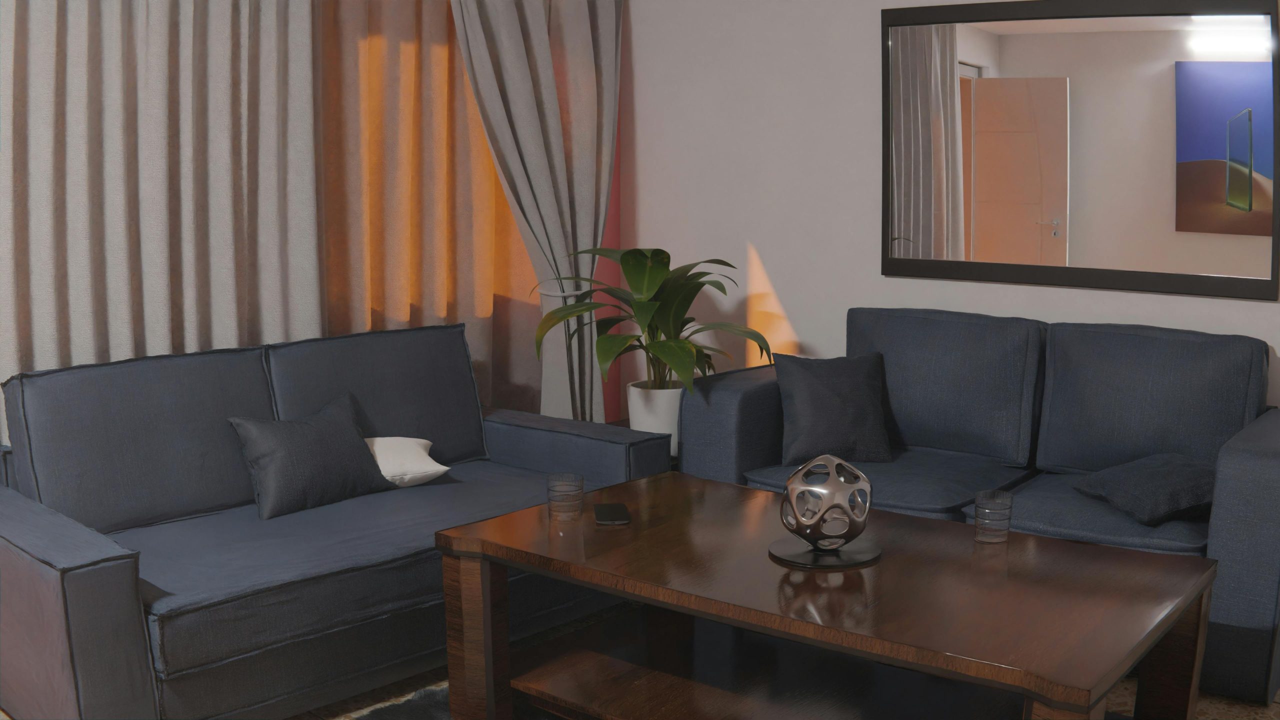 Inviting living room setting featuring blue sofas, wooden table, and contemporary decorations.