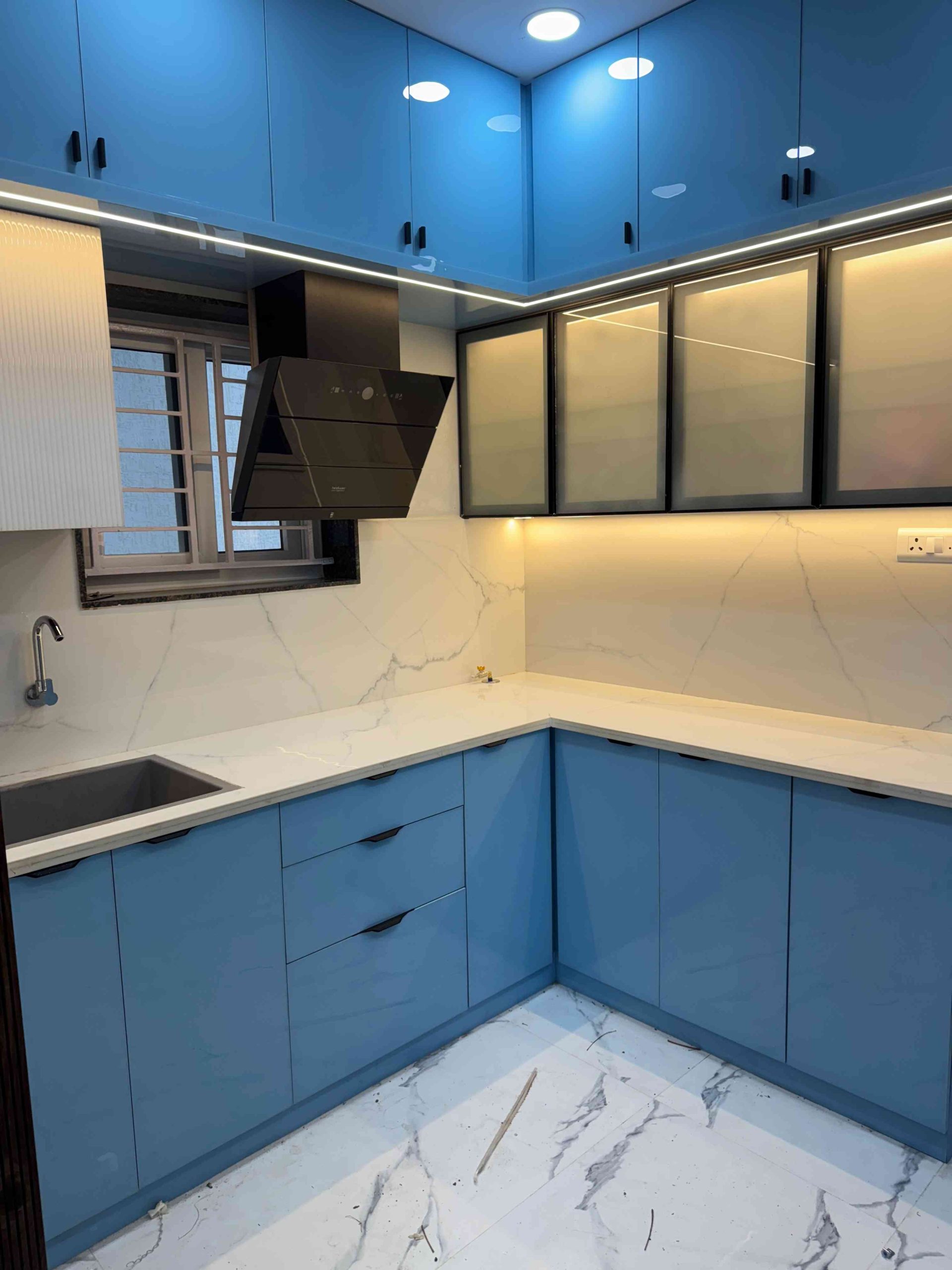 Modern Blue Island Kitchen Design with Marble Countertops by C9 Corp Interiors | KreateCube