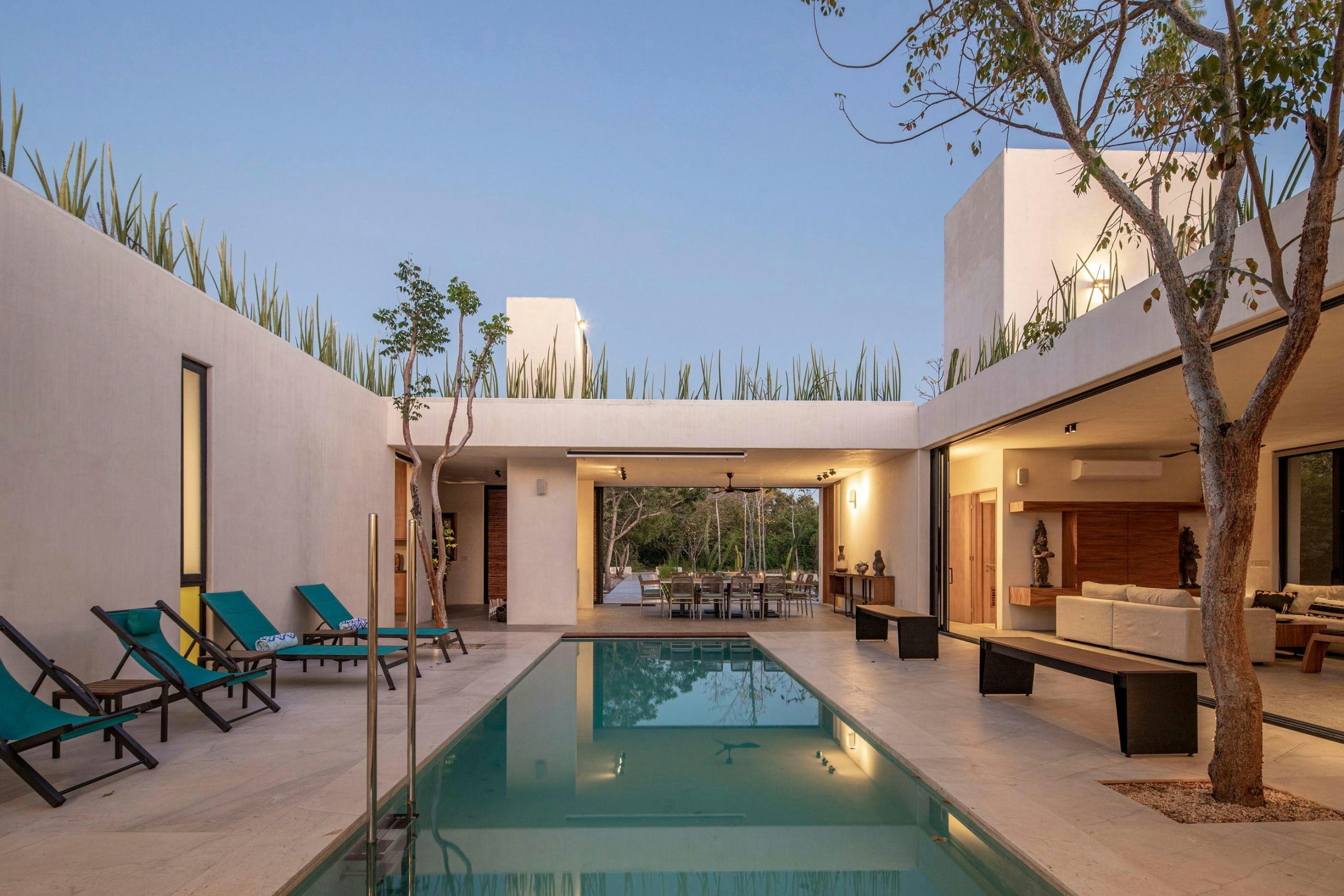 Modern courtyard with swimming pool and lounge chairs