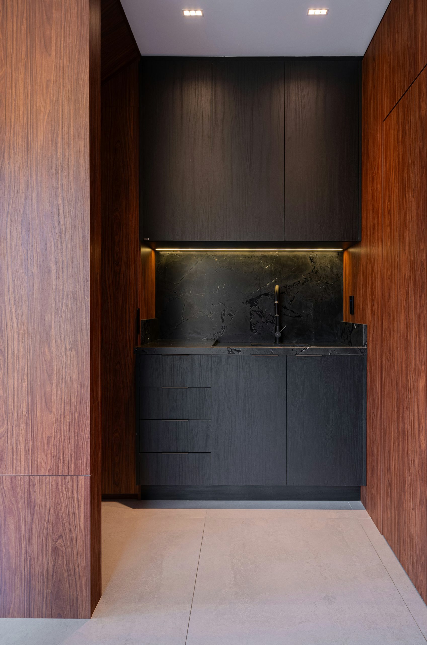 Modern dark kitchen with wood accents