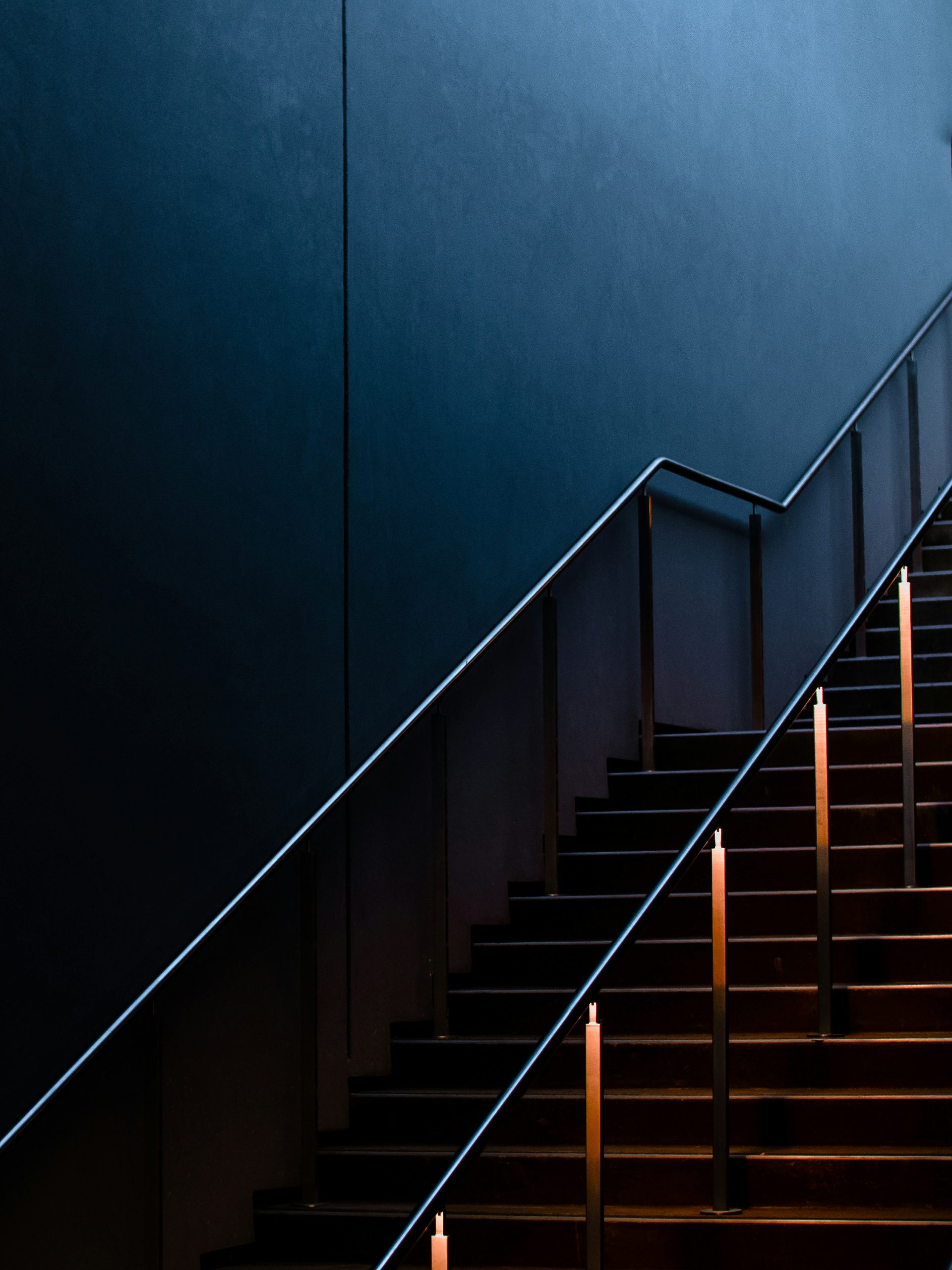 Modern lighting on a staircase railing.