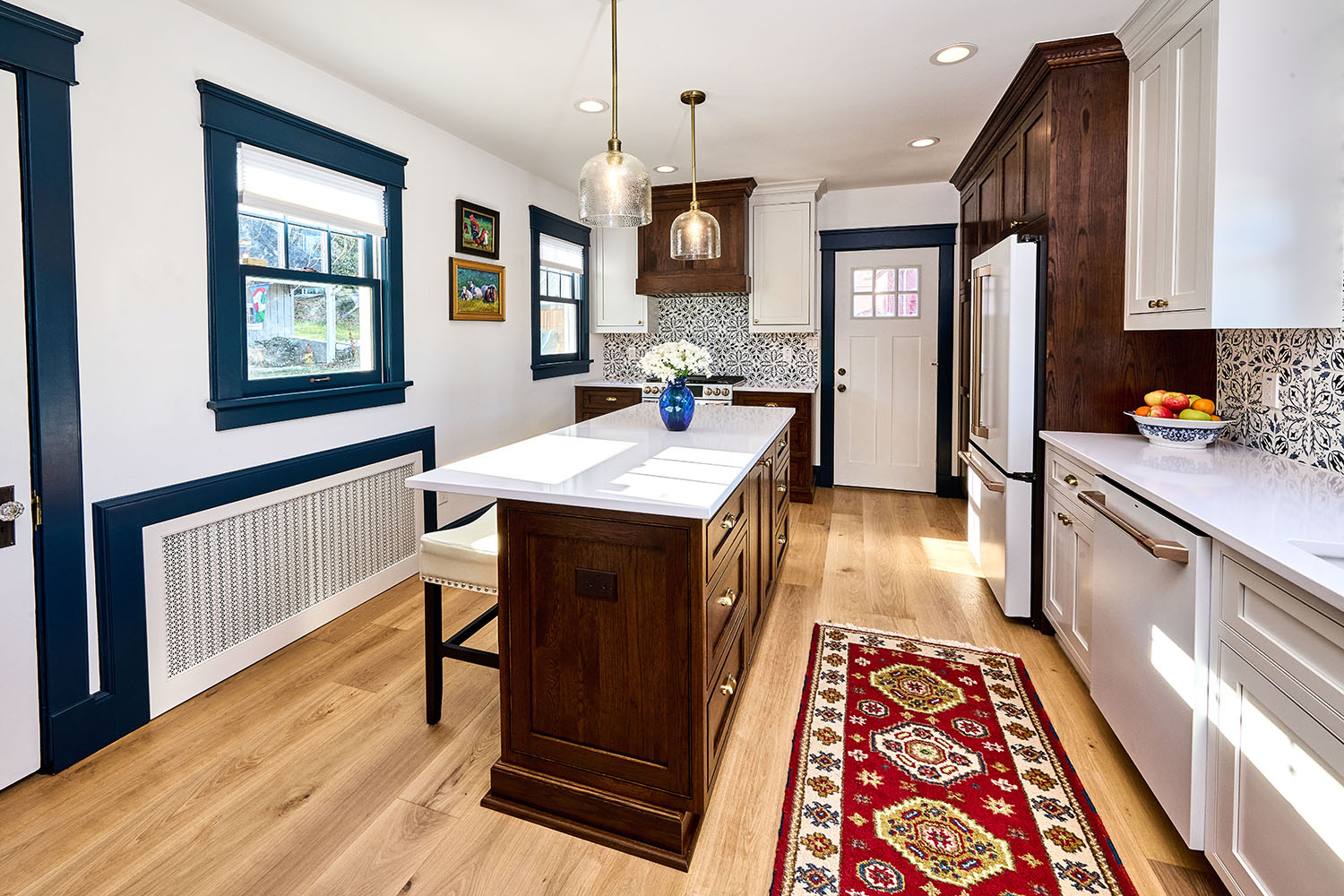Modern White and Oak Kitchen With Blue Accent