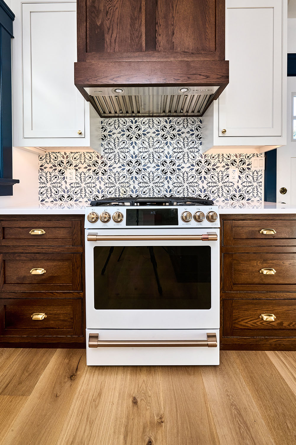Modern White and Oak Kitchen With Blue Accent
