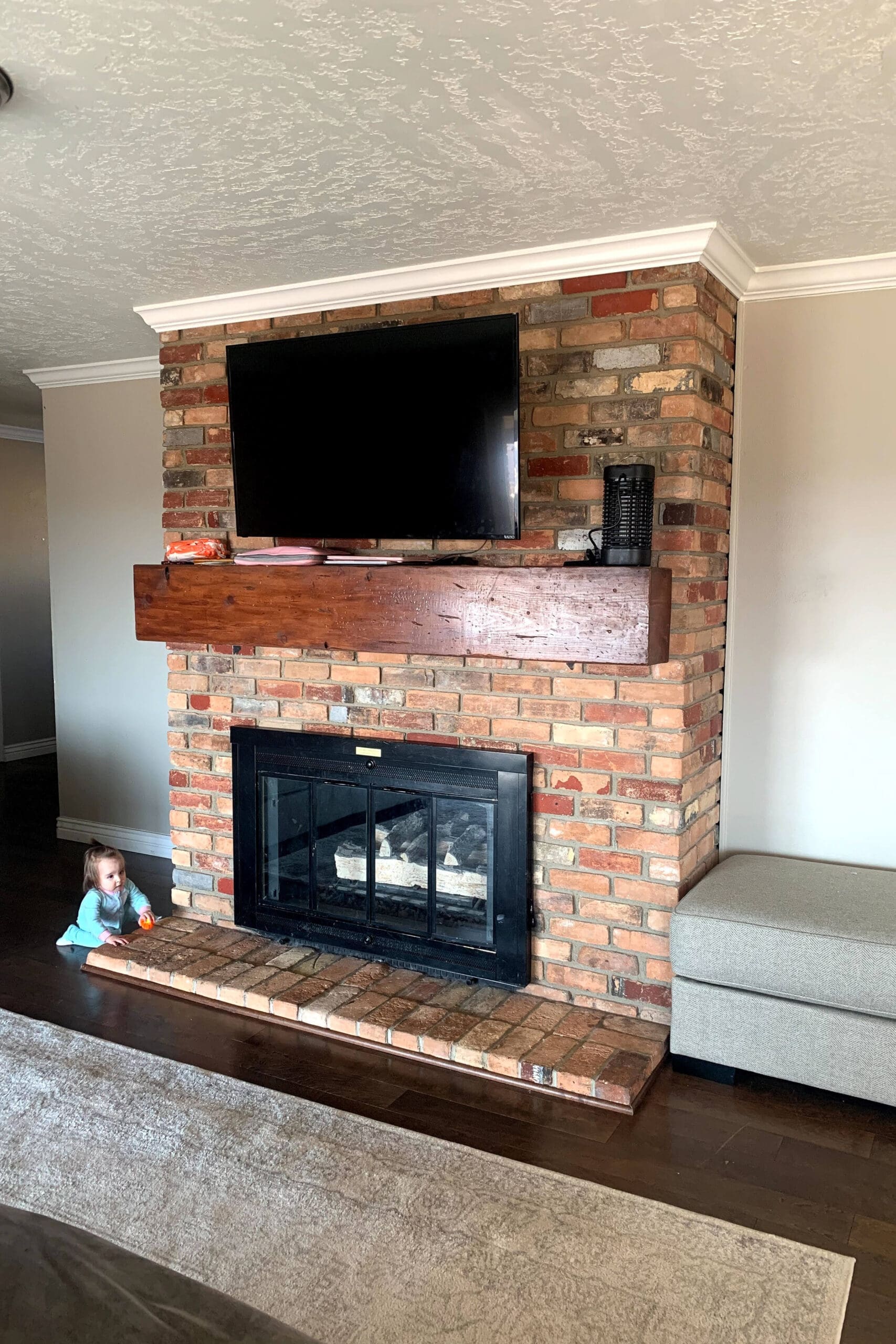 Painted Brick Fireplace With a DIY Wood Mantel | Crystel Montenegro Home