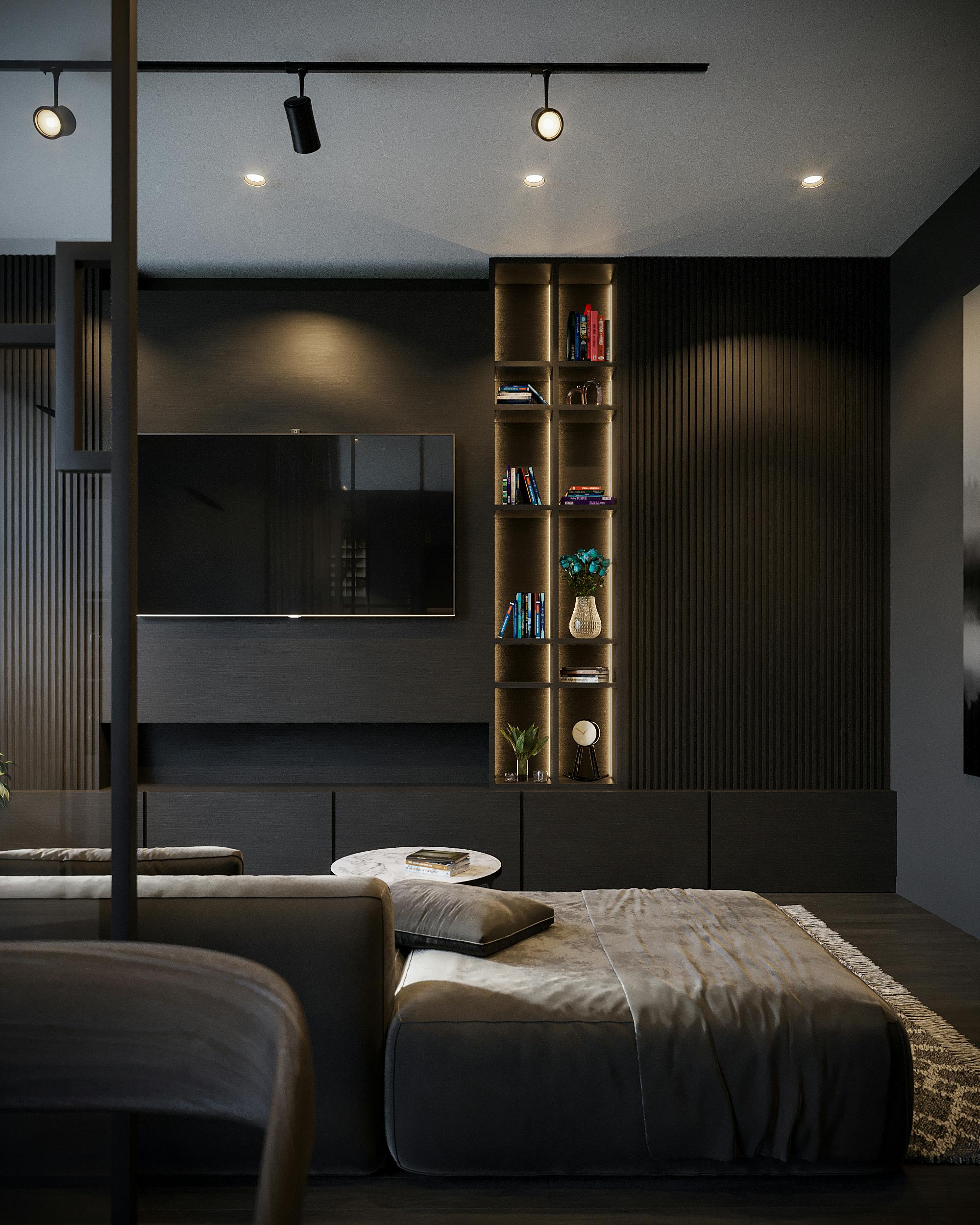Sleek modern living room featuring dark tones, wall TV, and elegant furniture.