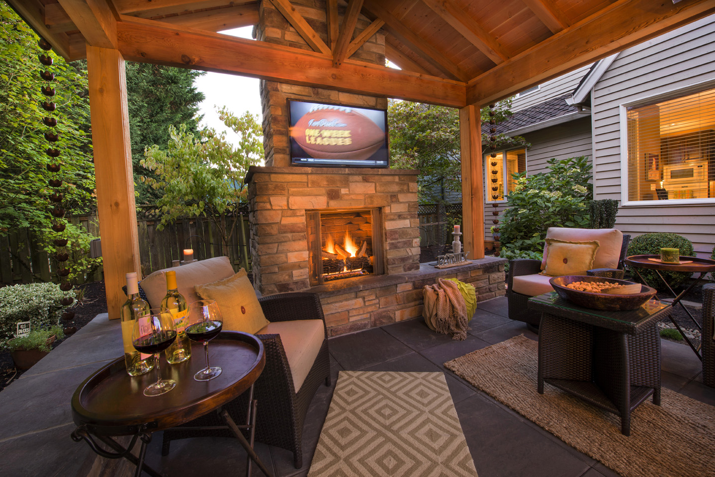 Stone Fireplace w/Seat Walls & TV - Premier Backyard Living