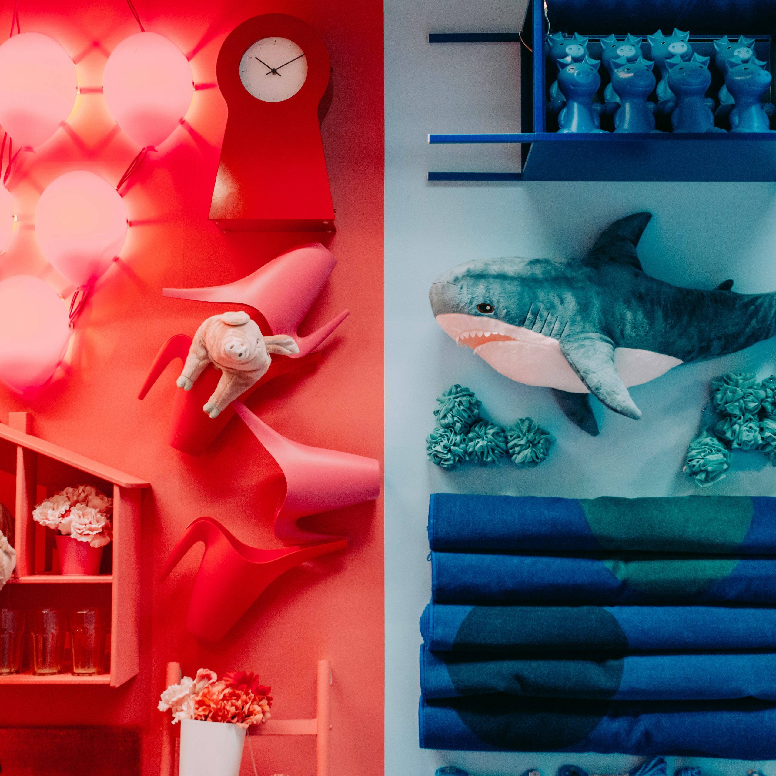 white and red bird figurine on blue wooden shelf